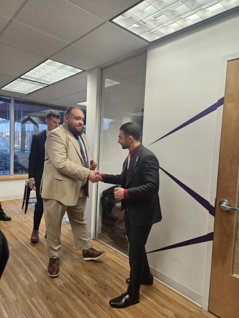 Two marketing professionals doing a handshake, representing an effective face-to-face marketing